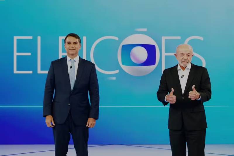 Debate da Globo: Lula e Flávio Bolsonaro discutem dívidas dos brasileiros, salário mínimo e SUS e trocam ofensas e ataques com "nove dedos" e "miliciano" 25 flavio e lula debate globo 231026